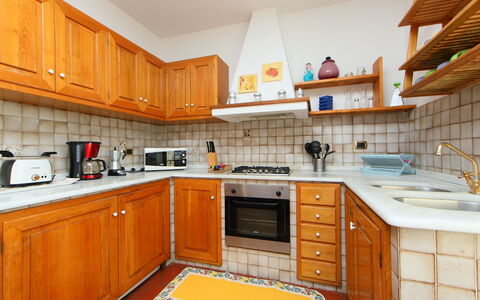 Olivo: Countertop, Kitchen, Cabinetry, Property, Room, Furniture, Building, Orange, Interior Design, Real Estate