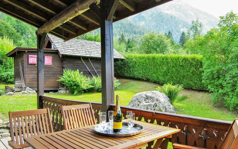 L'Piri: Table, Plant, Property, Furniture, Tree, Outdoor Furniture, Wood, Outdoor Table, Shade, Interior Design