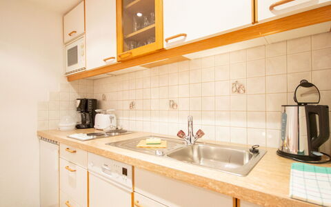 Christian: Property, Room, Kitchen, Furniture, Cabinetry, Countertop, House, Yellow, Building, Interior Design