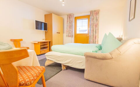 Christian: Room, Furniture, Property, Bedroom, Bed, Interior Design, Yellow, Bed Sheet, Building, Floor
