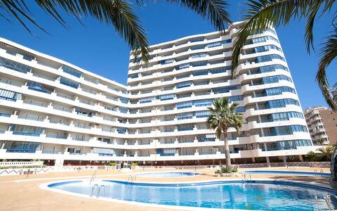 Turquesa Beach 03: Sky, Water, Building, Daytime, Property, Blue, Azure, Plant, Tree, Body Of Water