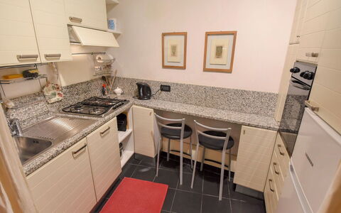 Sotoportego Venier: Room, Property, Kitchen, Countertop, Major Appliance, Furniture, Floor, Building, Kitchen Stove, Cabinetry