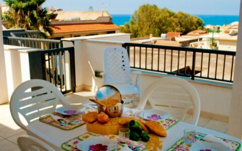 Cava Larica: Sky, Furniture, Building, Tableware, Azure, Table, Seaside Resort, Blue, Chair, Interior Design