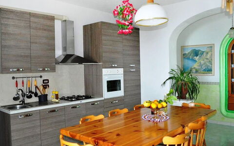 Dea Afrodite: Room, Furniture, Property, Kitchen, Interior Design, Yellow, Building, Floor, Countertop, Ceiling