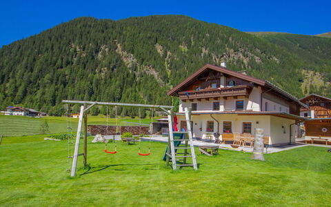 Schmittnhof: Sky, Mountain, Plant, Building, Ecoregion, Tree, Window, Land Lot, Grass, Leisure