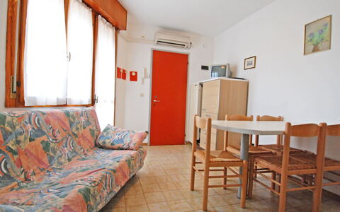 Bibione 320: Furniture, Table, Property, Picture Frame, Wood, Lighting, Orange, Interior Design, Comfort, Floor