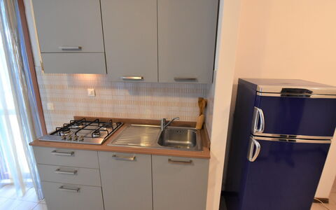 Bibione 360: Cabinetry, Gas Stove, Kitchen Stove, Cooktop, Kitchen Appliance, Countertop, Kitchen, Home Appliance, Stove, Interior Design
