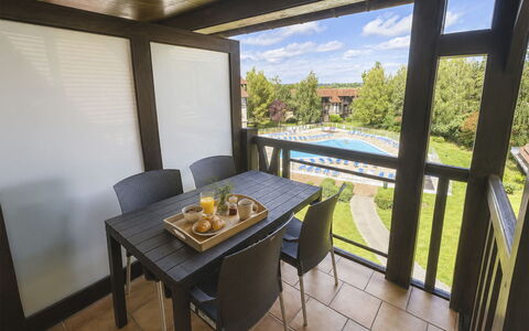 Résidence du Golf: Wood, Furniture, Wood Stain, Ceiling, Hardwood, Chair, Shade, Outdoor Table, Kitchen & Dining Room Table, Outdoor Furniture