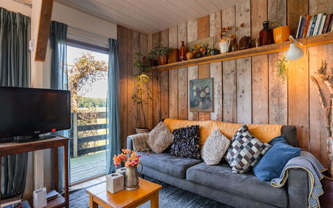 Polderzicht: Furniture, Picture Frame, Property, Couch, Table, Lighting, Interior Design, Living Room, Orange, Wood