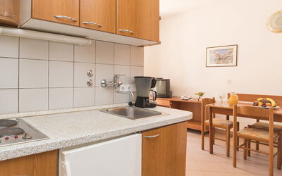 Polynesia 210.5: Countertop, Room, Property, Kitchen, Furniture, Cabinetry, Interior Design, Building, Yellow, House