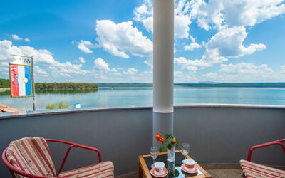 Raslina 100: Water, Sky, Cloud, Furniture, Table, Property, Daytime, Light, Blue, Chair