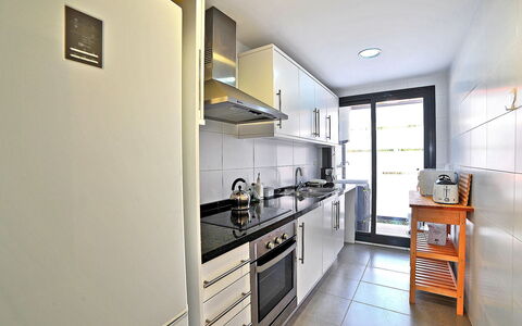 Isleta Marina: Property, Room, Kitchen, Building, Furniture, Interior Design, House, Yellow, Cabinetry, Countertop