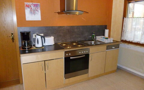Landhaus Weisser: Property, Room, Kitchen, Kitchen Stove, Countertop, Furniture, Cabinetry, Major Appliance, Building, Floor