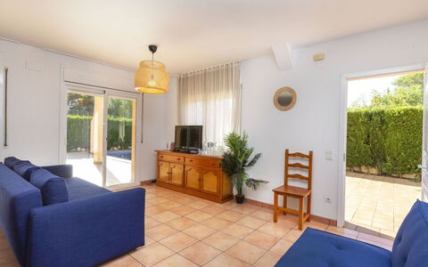 Villa Cala Nova a: Furniture, Plant, Houseplant, Comfort, Couch, Interior Design, Wood, Flooring, Living Room, Shade