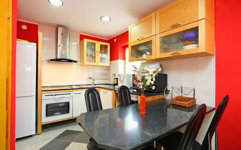 Terracotta: Room, Property, Furniture, Interior Design, Countertop, Kitchen, Building, Red, Ceiling, Cabinetry