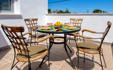 Anguilaga: Table, Furniture, Sky, Chair, Outdoor Table, Window, Wood, Outdoor Furniture, Shade, Interior Design