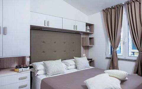 Castiglione della Pescaia 140: Bedroom, Furniture, Bed, Room, Property, Interior Design, Bed Sheet, Bed Frame, Mattress, Curtain