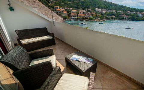 Repak: Water, Building, Boat, Sky, Watercraft, Couch, Outdoor Furniture, Comfort, Table, Floor