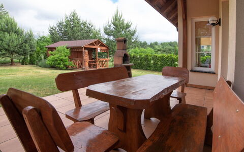 Villa von Valdi: Table, Sky, Property, Furniture, Plant, Cloud, Building, Tree, Wood, Outdoor Furniture