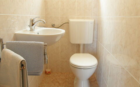 Anderson: Bathroom, Toilet, Toilet Seat, Property, Wall, Plumbing Fixture, Tap, Tile, Bathroom Accessory, Ceramic