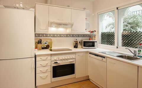 El Presidente: Room, Cabinetry, Kitchen, Property, Furniture, Countertop, Major Appliance, Kitchen Stove, Interior Design, Building