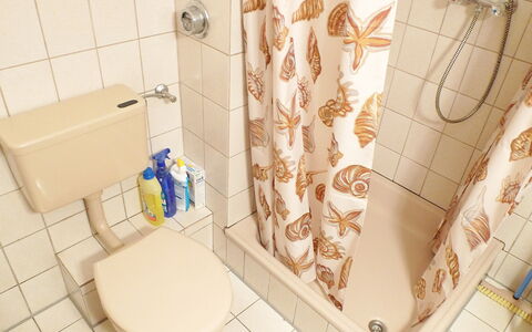 Norderney: Bathroom, Tile, Property, Toilet, Room, Wall, Plumbing Fixture, Toilet Seat, Floor, Interior Design