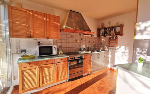 Agora: Cabinetry, Countertop, Property, Kitchen, Kitchen Appliance, Kitchen Stove, Wood, Home Appliance, Orange, Interior Design