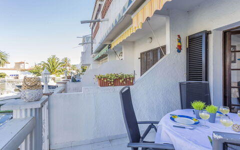 Porto Fino: Building, Daytime, Property, Sky, Flowerpot, Furniture, Table, Plant, White, Azure