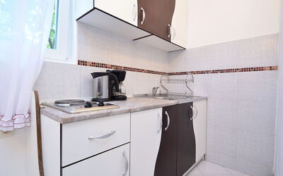 Mira 107.1: Room, Property, Furniture, Kitchen, House, Interior Design, Material Property, Real Estate, Cabinetry, Architecture