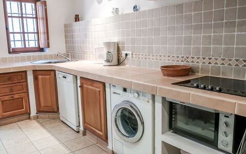 Maury: Property, Room, Kitchen, Furniture, Countertop, Cabinetry, Major Appliance, Building, Tile, Floor