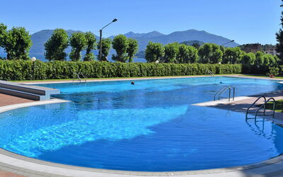 Porto Valtravaglia 200: Water, Sky, Blue, Swimming Pool, Azure, Tree, Natural Landscape, Leisure, Plant, Shade