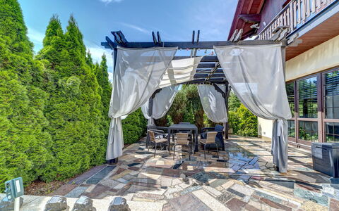 Zameczek Falsztyn: Outdoor Furniture, Shade, Furniture, Garden, Chair, Backyard, Eco Hotel, Resort, Landscaping, Patio