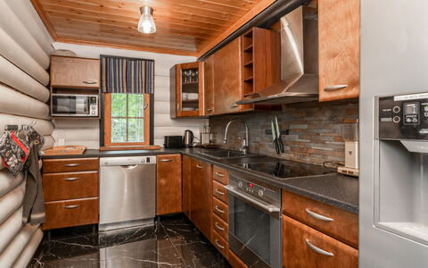 Villa Assi: Kitchen, Flooring, Countertop, Kitchen Appliance, Wood, Furniture, Interior Design, Floor, Major Appliance, Cabinetry