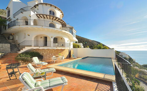 Vista Panorama: Water, Sky, Building, Property, Plant, Window, Swimming Pool, Seaside Resort, Outdoor Furniture, Chair