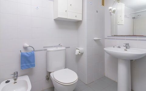 Girasol: Bathroom, Property, Toilet, Room, Plumbing Fixture, Bathroom Accessory, Tap, Toilet Seat, Wall, Purple