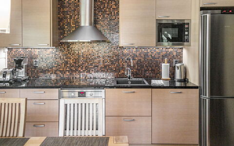 Villa Illi: Kitchen, Kitchen Appliance, Countertop, Major Appliance, Interior Design, Flooring, Cabinetry, Wood, Furniture, Kitchen Stove