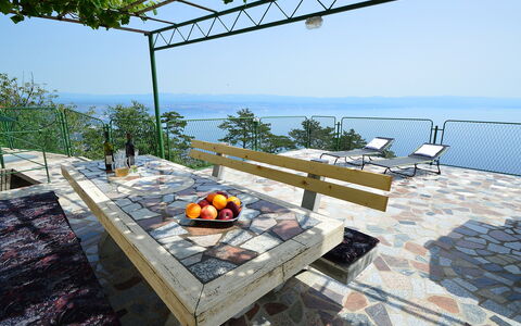 Josip: Table, Sky, Furniture, Water, Outdoor Furniture, Shade, Wood, Outdoor Table, Chair, Leisure