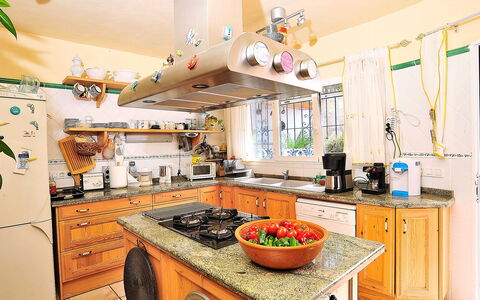 Mirada al Sol: Countertop, Kitchen, Room, Property, Interior Design, Yellow, Cabinetry, House, Furniture, Building