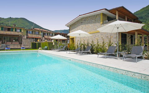 Lago D'Idro 100: Water, Sky, Plant, Property, Swimming Pool, Azure, Building, Outdoor Furniture, Chair, Umbrella