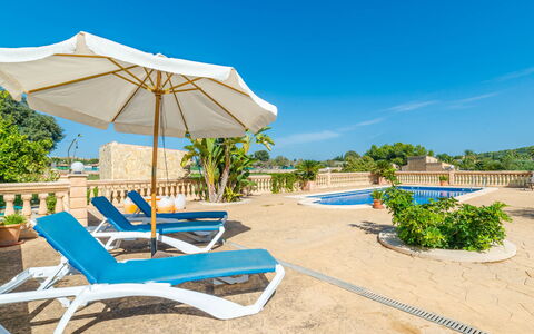 Can Josepot: Sky, Plant, Plant Community, Azure, Sunlounger, Shade, Outdoor Furniture, Tree, Arecales, Umbrella