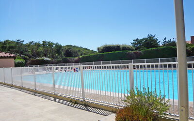 Six Fours la Coudoulière 500: Water, Building, Property, Sky, Plant, Tree, Window, Leisure, Urban Design, Swimming Pool