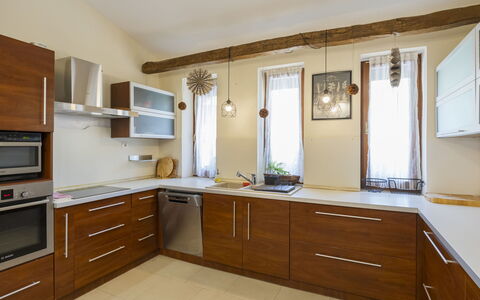 Villa Mediterran: Furniture, Kitchen, Flooring, Countertop, Cabinetry, Interior Design, Wood, Floor, Kitchen Appliance, Home