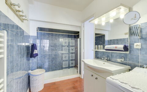 Grimaud 131: Property, Bathroom Cabinet, Plumbing Fixture, Sink, Shower Head, Cabinetry, Mirror, Purple, Bathroom, Building