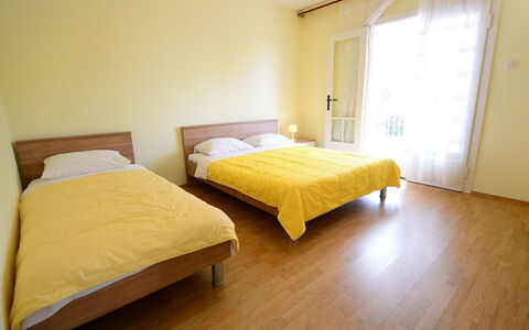 Franjo: Bed, Bedroom, Furniture, Room, Floor, Property, Bed Frame, Hardwood, Bed Sheet, Yellow
