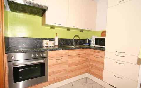 Evi: Property, Countertop, Kitchen, Cabinetry, Room, Furniture, Kitchen Stove, Major Appliance, Tile, House