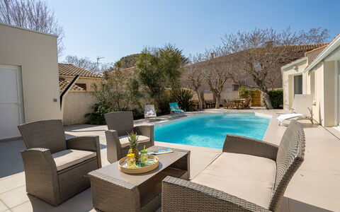 Villa du Littoral: Sky, Furniture, Plant, Property, Couch, Building, Azure, Chair, Table, Interior Design