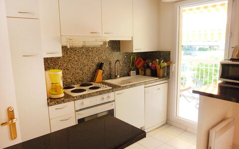 Résidence les Jardins D'Eden: Property, Room, Countertop, Kitchen, Yellow, Furniture, Cabinetry, Kitchen Stove, Floor, Interior Design