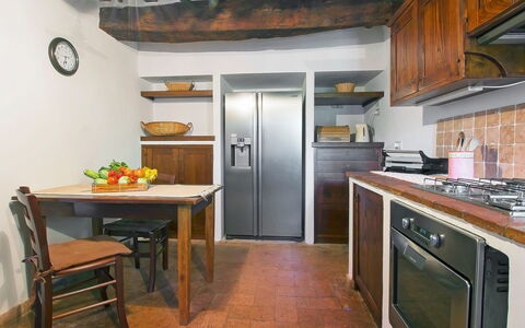 Cinigiano 100: Countertop, Room, Property, Kitchen, Furniture, Cabinetry, Building, Floor, Interior Design, Kitchen Stove