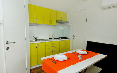 Camping Baško Polje 200.1: Room, Property, Yellow, Orange, Furniture, Interior Design, Kitchen, Building, House, Real Estate