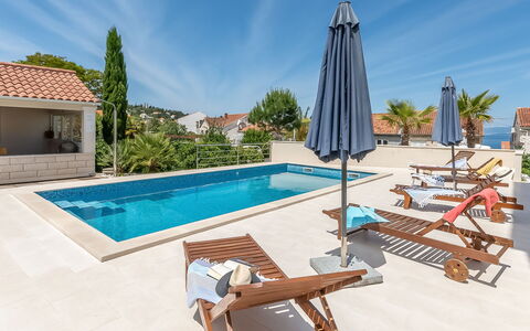 Brač Sutivan 104: Sky, Property, Furniture, Plant, Water, Building, Swimming Pool, Azure, Shade, Outdoor Furniture